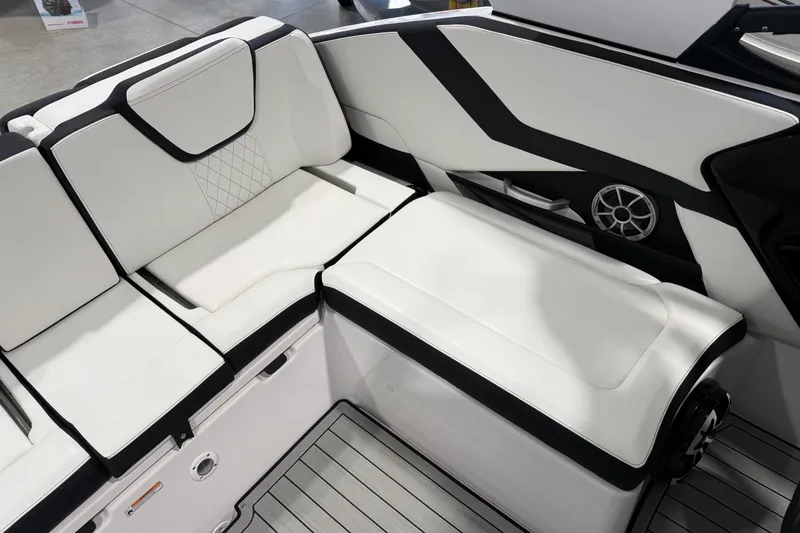 Slide: The Image of 2025 Yamaha Boats 252S interior with sleek white seating and modern design. - 9