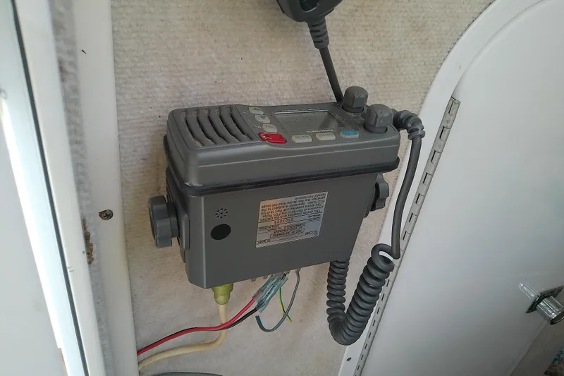 Slide: The Image of Marine radio equipment inside a 1996 Shamrock 260 Express boat cabin. - 22