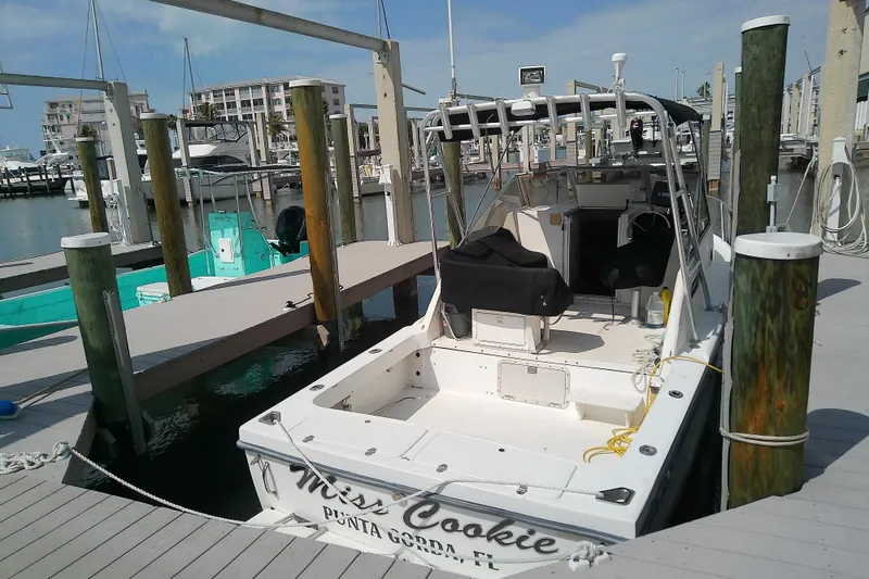 Slide: The Image of 1996 Shamrock 260 Express boat docked at marina in Punta Gorda, Florida. - 5