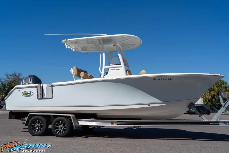 Slide: The Image of 2017 Sea Hunt Ultra 235 SE boat on trailer under clear blue sky. - 15