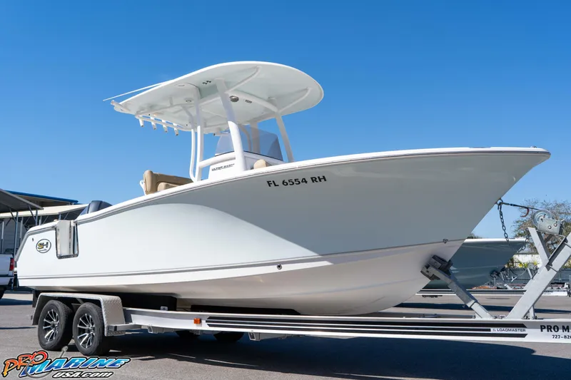 The Image of 2017 Sea Hunt Ultra 235 SE boat on trailer under clear blue sky. - 2