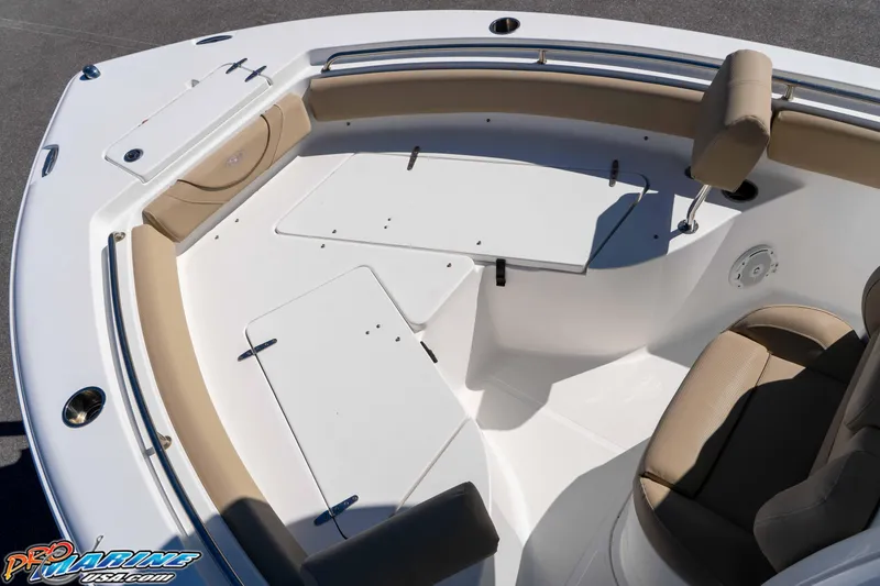 Slide: The Image of 2017 Sea Hunt Ultra 235 SE boat interior with cushioned seating and storage compartments. - 30
