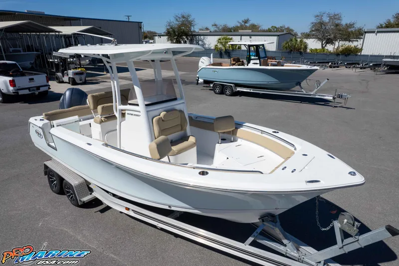 Slide: The Image of 2017 Sea Hunt Ultra 235 SE boat on trailer in marina lot. - 35