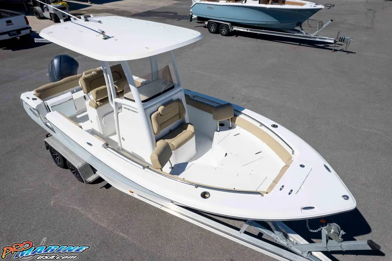 Slide: The Image of 2017 Sea Hunt Ultra 235 SE boat on trailer, featuring spacious seating and sleek design. - 36