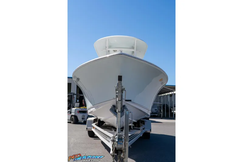 Slide: The Image of 2017 Sea Hunt Ultra 235 SE boat on trailer, viewed from front under clear blue sky. - 4