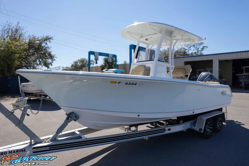 Slide: The Image of 2017 Sea Hunt Ultra 235 SE boat on trailer, parked outdoors. - 41