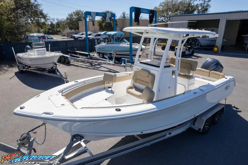 Slide: The Image of 2017 Sea Hunt Ultra 235 SE boat on trailer in marina setting. - 42