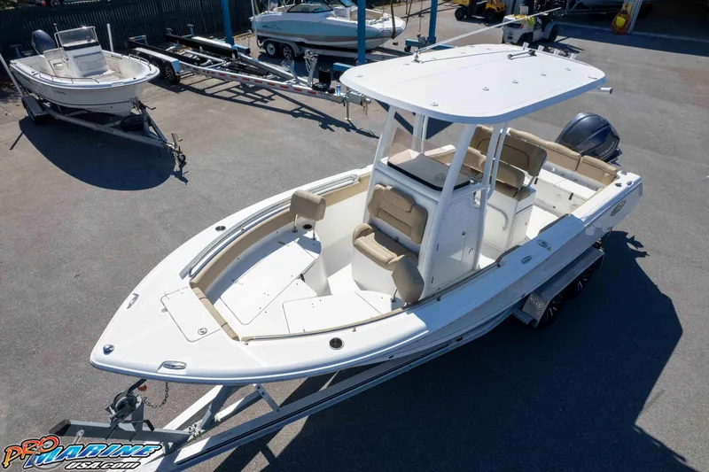 Slide: The Image of 2017 Sea Hunt Ultra 235 SE boat on trailer in a marina setting. - 43