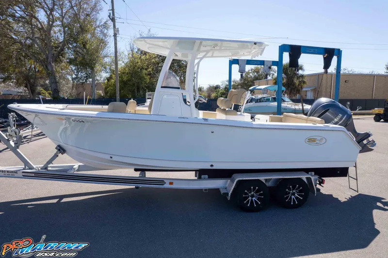 Slide: The Image of 2017 Sea Hunt Ultra 235 SE boat on trailer, parked outdoors. - 44