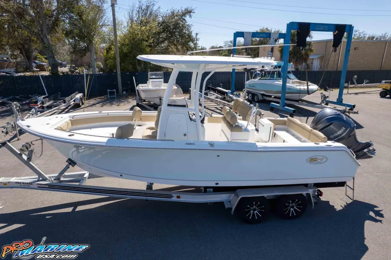 Slide: The Image of 2017 Sea Hunt Ultra 235 SE boat on trailer, parked outdoors. - 45