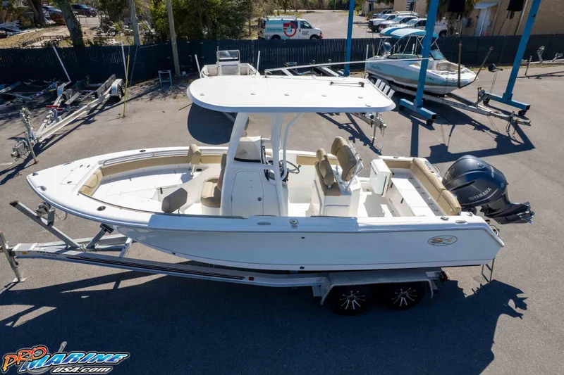 Slide: The Image of 2017 Sea Hunt Ultra 235 SE boat on trailer, parked outdoors. - 46