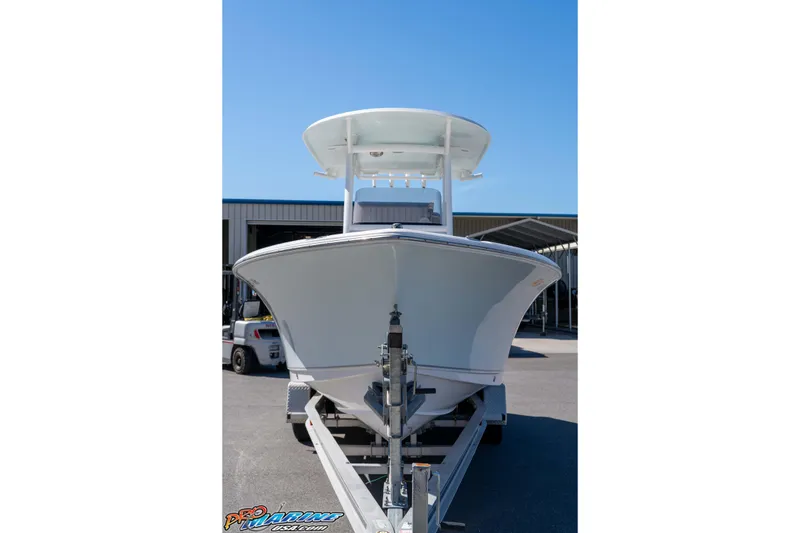 Slide: The Image of 2017 Sea Hunt Ultra 235 SE boat on trailer, front view, under clear blue sky. - 5