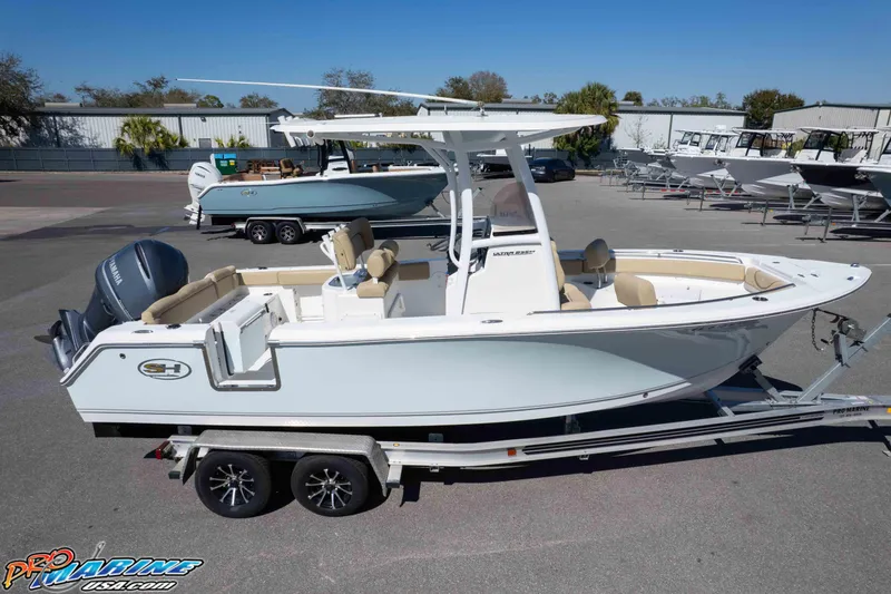 Slide: The Image of 2017 Sea Hunt Ultra 235 SE boat on trailer, parked outdoors under clear sky. - 57