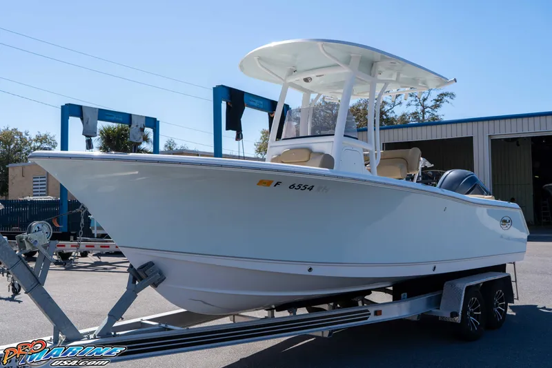 Slide: The Image of 2017 Sea Hunt Ultra 235 SE boat on trailer, parked outdoors. - 7