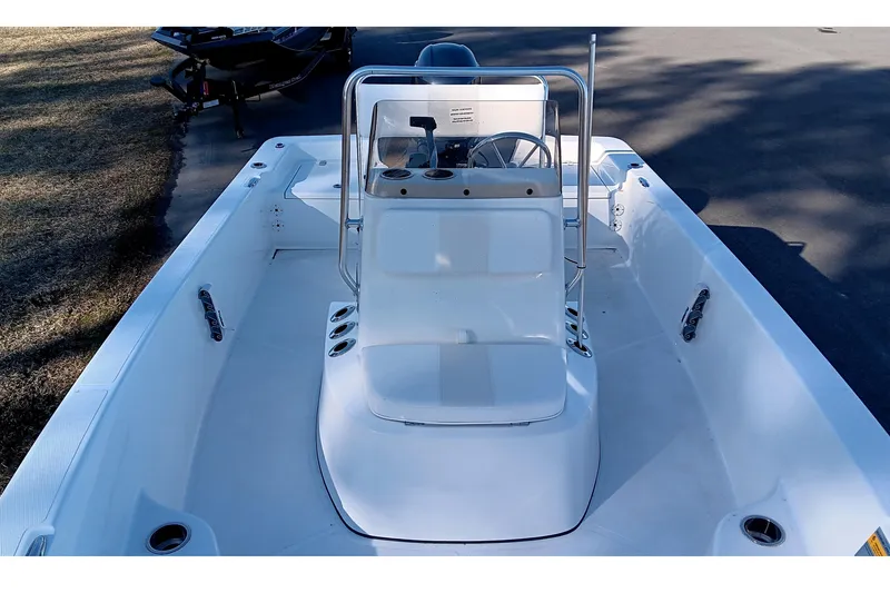 Slide: The Image of 2026 Frontier 180 boat interior with seating and storage cooler on deck. - 13