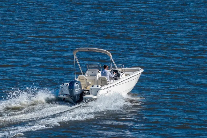 Slide: The Image of 2026 Scout 188 Sport Dorado boat cruising on open water. - 10