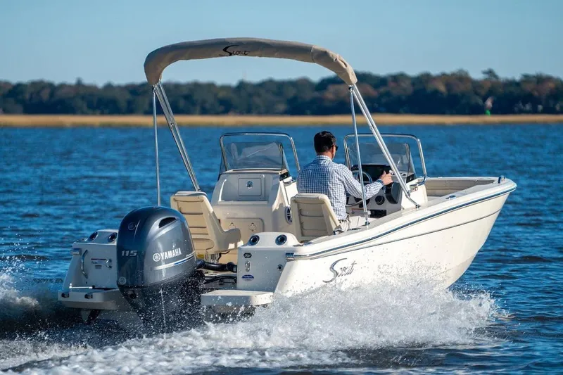 Slide: The Image of 2026 Scout 188 Sport Dorado boat cruising on a lake with Yamaha engine. - 12