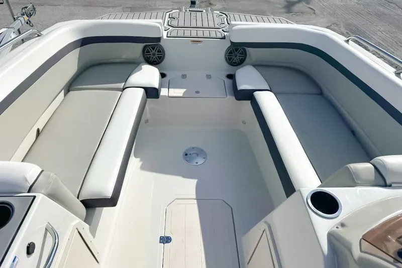 Slide: The Image of 2024 Starcraft SVX 211 OB boat interior with spacious seating and cup holders. - 6