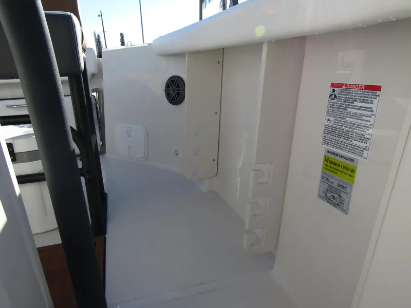 Slide: The Image of 2024 Starcraft SVX 231 OB CC boat interior detail with safety labels. - 16