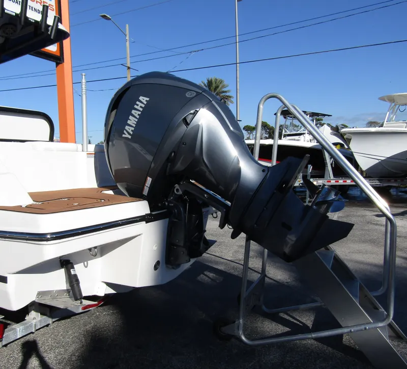 Slide: The Image of 2024 Starcraft SVX 231 OB CC boat with Yamaha outboard motor. - 2