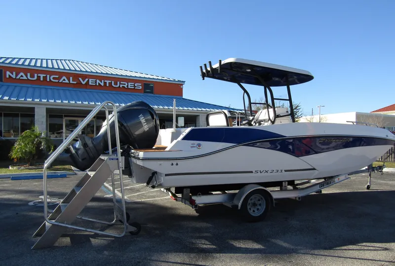Slide: The Image of 2024 Starcraft SVX 231 OB CC boat on trailer at Nautical Ventures. - 3