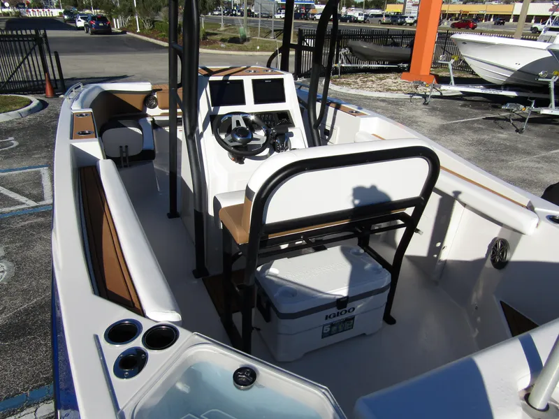 Slide: The Image of 2024 Starcraft SVX 231 OB CC boat interior with console and seating. - 35