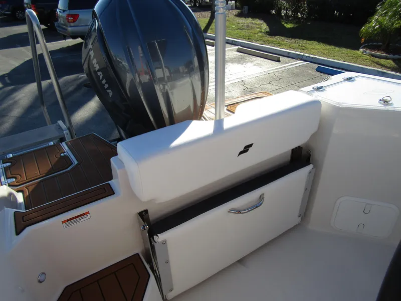 Slide: The Image of 2024 Starcraft SVX 231 OB CC boat with Yamaha outboard motor and foldable bench seat. - 23