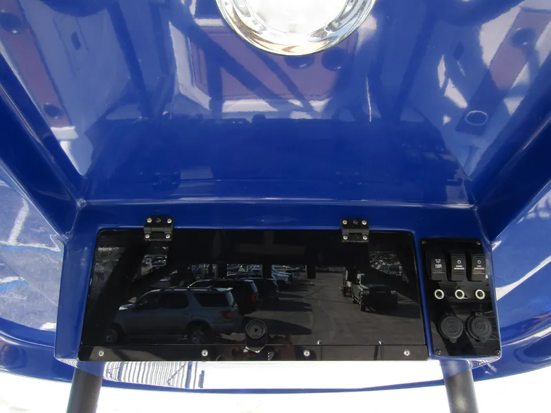 Slide: The Image of 2024 Starcraft SVX 231 OB CC boat console with blue canopy. - 20