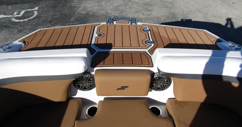 Slide: The Image of 2024 Starcraft SVX 231 OB CC boat interior with brown and white seating. - 7