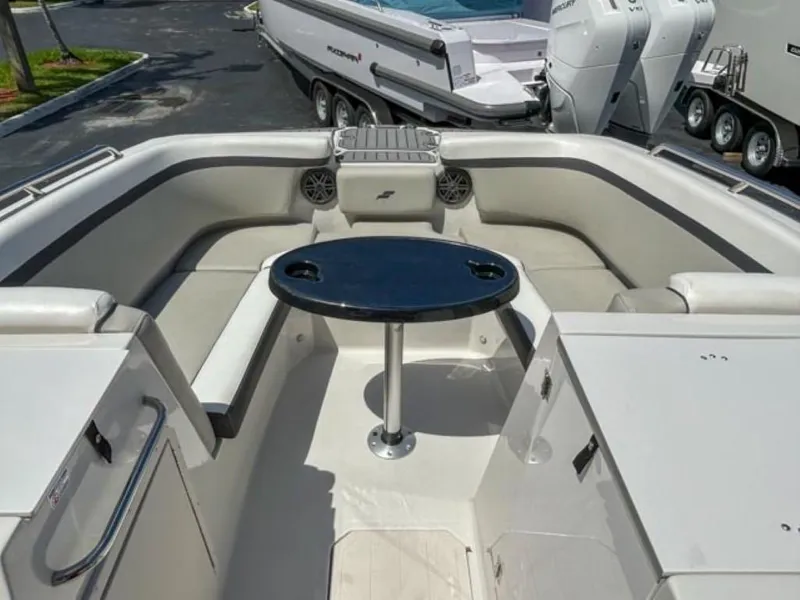 Slide: The Image of 2024 Starcraft SVX 231 OB DH boat interior with seating and table. - 4