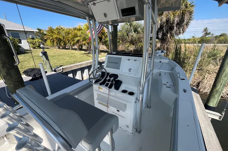 Slide: The Image of 2022 KenCraft 239 Bay Rider boat interior with steering console and seating. - 10