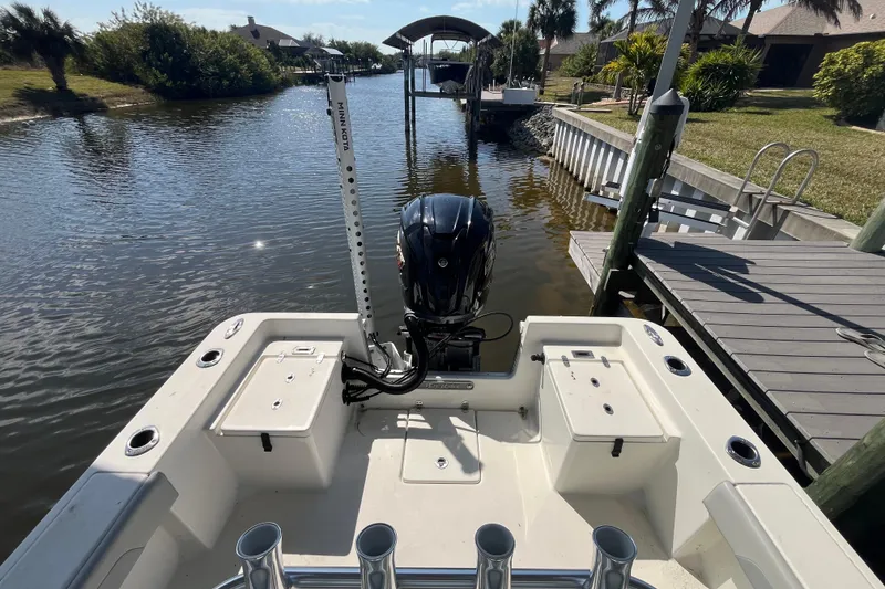 Slide: The Image of 2022 KenCraft 239 Bay Rider boat docked on a sunny canal. - 16