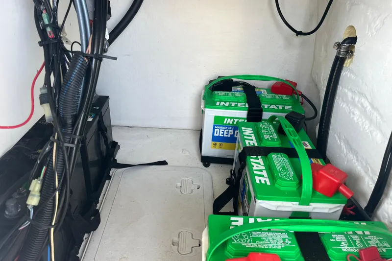 Slide: The Image of Battery compartment of 2022 KenCraft 239 Bay Rider with Interstate marine batteries. - 23