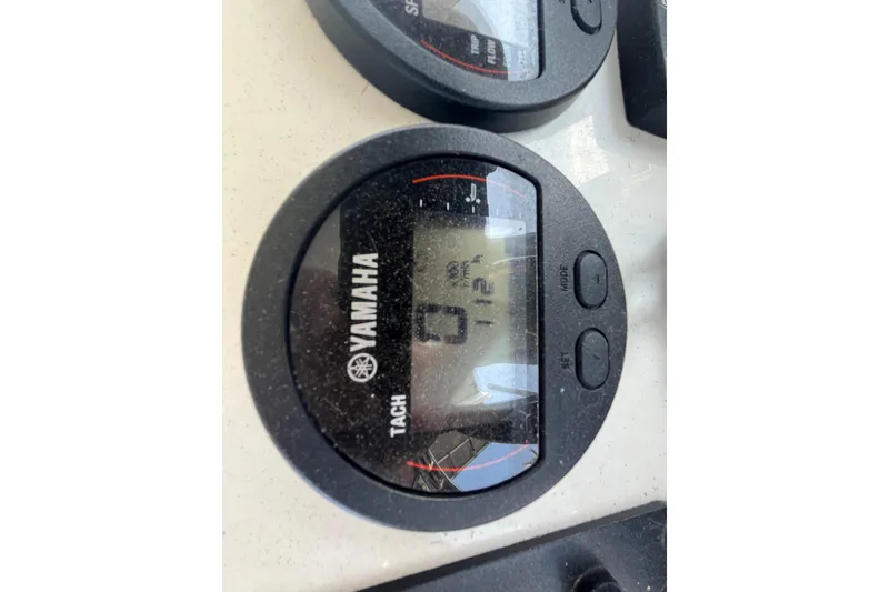 Slide: The Image of Yamaha tachometer on 2022 KenCraft 239 Bay Rider boat dashboard. - 26