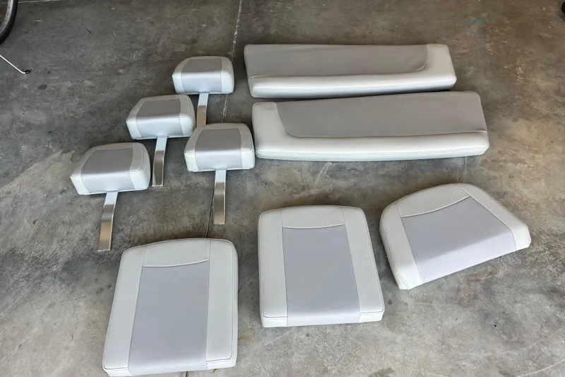 Slide: The Image of KenCraft 239 Bay Rider 2022 boat cushions and seats on concrete floor. - 27