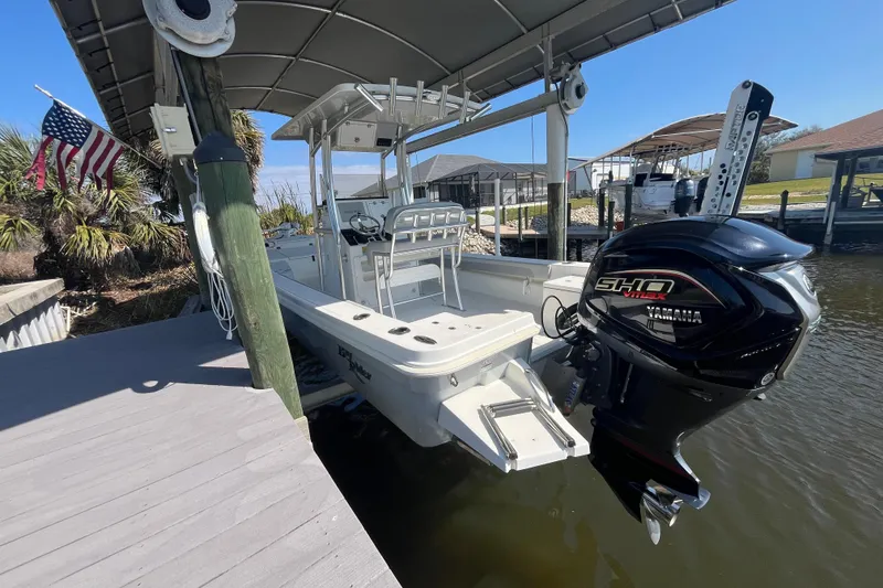 Slide: The Image of 2022 KenCraft 239 Bay Rider boat docked with Yamaha outboard motor. - 6
