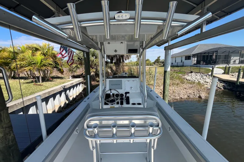 Slide: The Image of 2022 KenCraft 239 Bay Rider boat docked, featuring sleek design and modern equipment. - 7