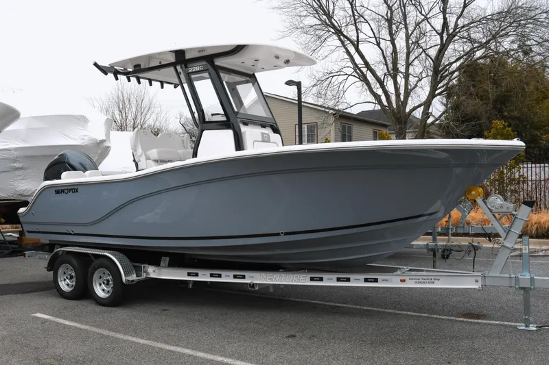 The Image of 2026 Sea Fox 228 Commander boat on trailer, parked outdoors. - 0