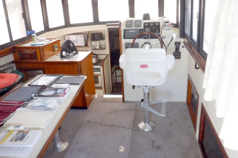Slide: The Image of Interior of 2004 Camano 31 Troll boat with helm, seating, and navigation equipment. - 15
