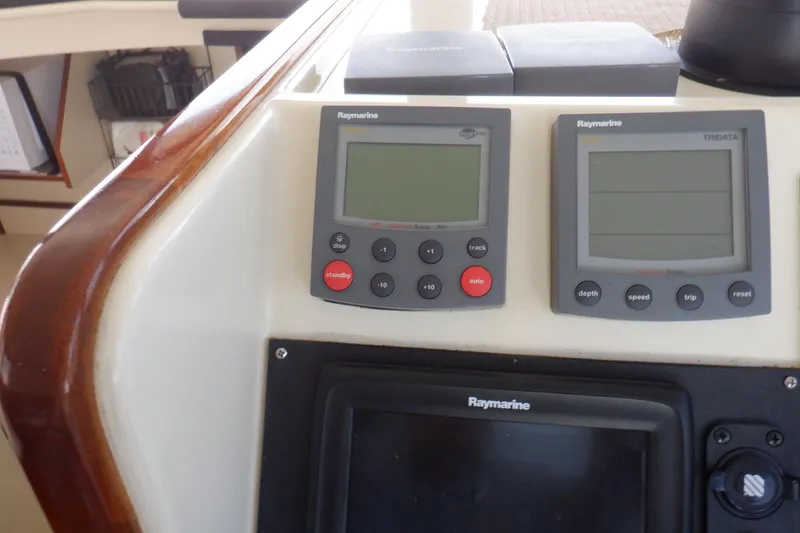 Slide: The Image of Raymarine navigation instruments on 2004 Camano 31 Troll boat dashboard. - 23