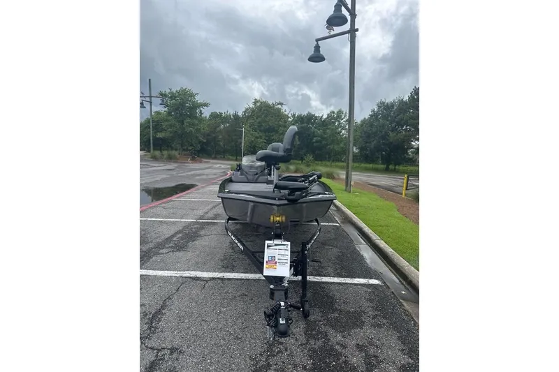 Slide: The Image of 2026 Tracker Pro 170 boat parked in a lot on a cloudy day. - 64