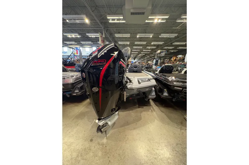 Slide: The Image of 2026 Ranger Z519R boat with powerful outboard motor displayed indoors. - 3