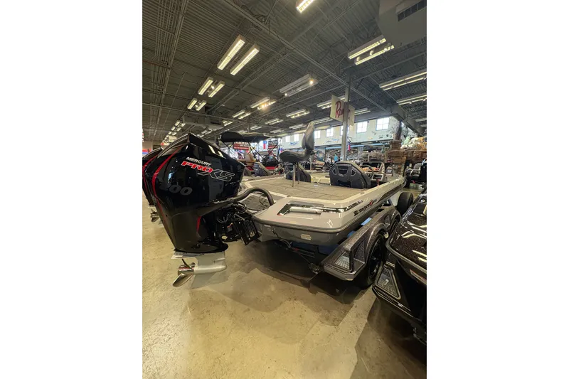 Slide: The Image of 2026 Ranger Z519R boat with Mercury Pro XS engine displayed indoors. - 4