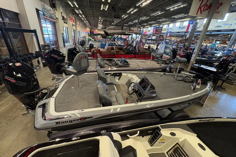 Slide: The Image of 2026 Ranger Z519R boat displayed in a showroom with modern features and sleek design. - 5