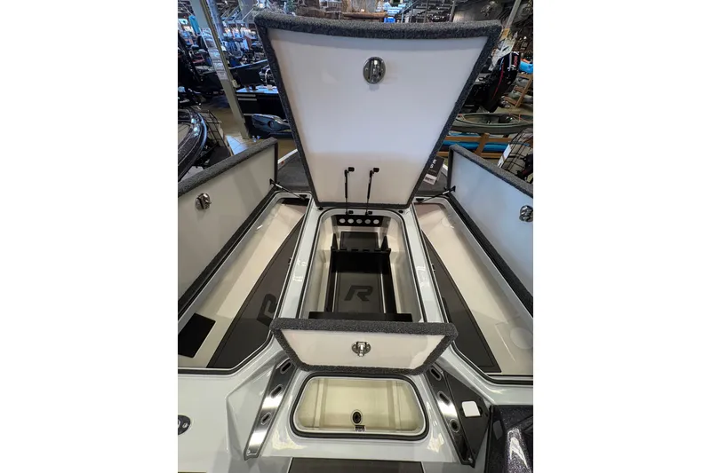 Slide: The Image of 2026 Ranger Z519R boat storage compartments open, showcasing spacious interior design. - 11