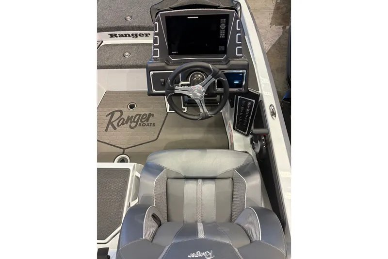 Slide: The Image of 2026 Ranger Z519R boat cockpit with steering wheel, dashboard, and branded seating. - 8
