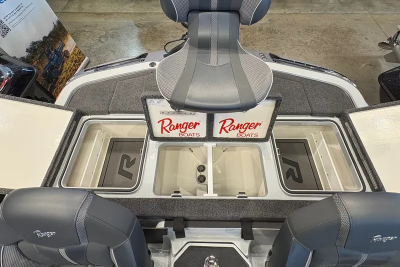 Slide: The Image of The image shows the cockpit of a Ranger Z519R boat with gray seats and storage compartments. - 15