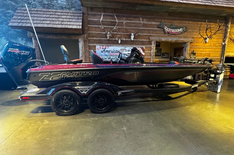 The Image of 2026 Nitro Z21 XL Pro boat displayed indoors with rustic decor background. - 0
