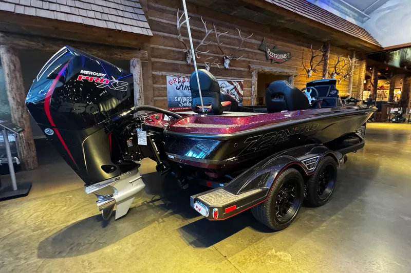 Slide: The Image of 2026 Nitro Z21 XL Pro boat with Mercury Pro XS engine displayed indoors. - 2