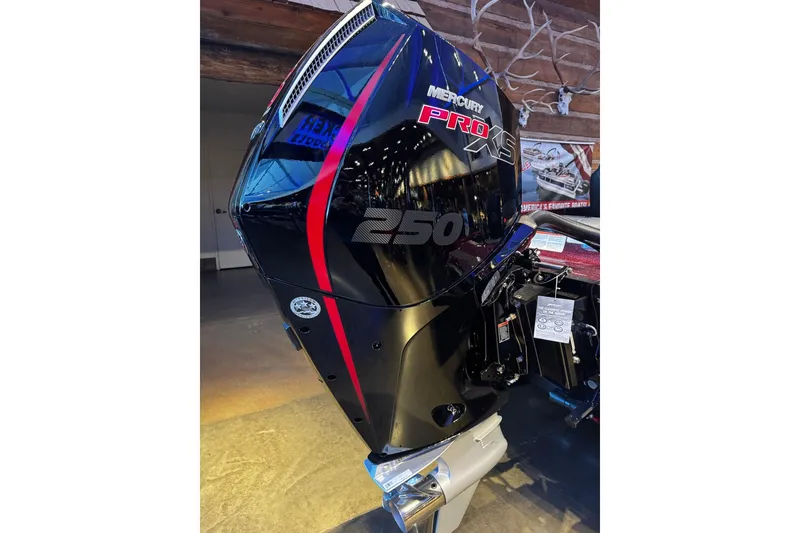 Slide: The Image of 2026 Nitro Z21 XL Pro boat with Mercury Pro XS 250 engine, showcased indoors. - 7